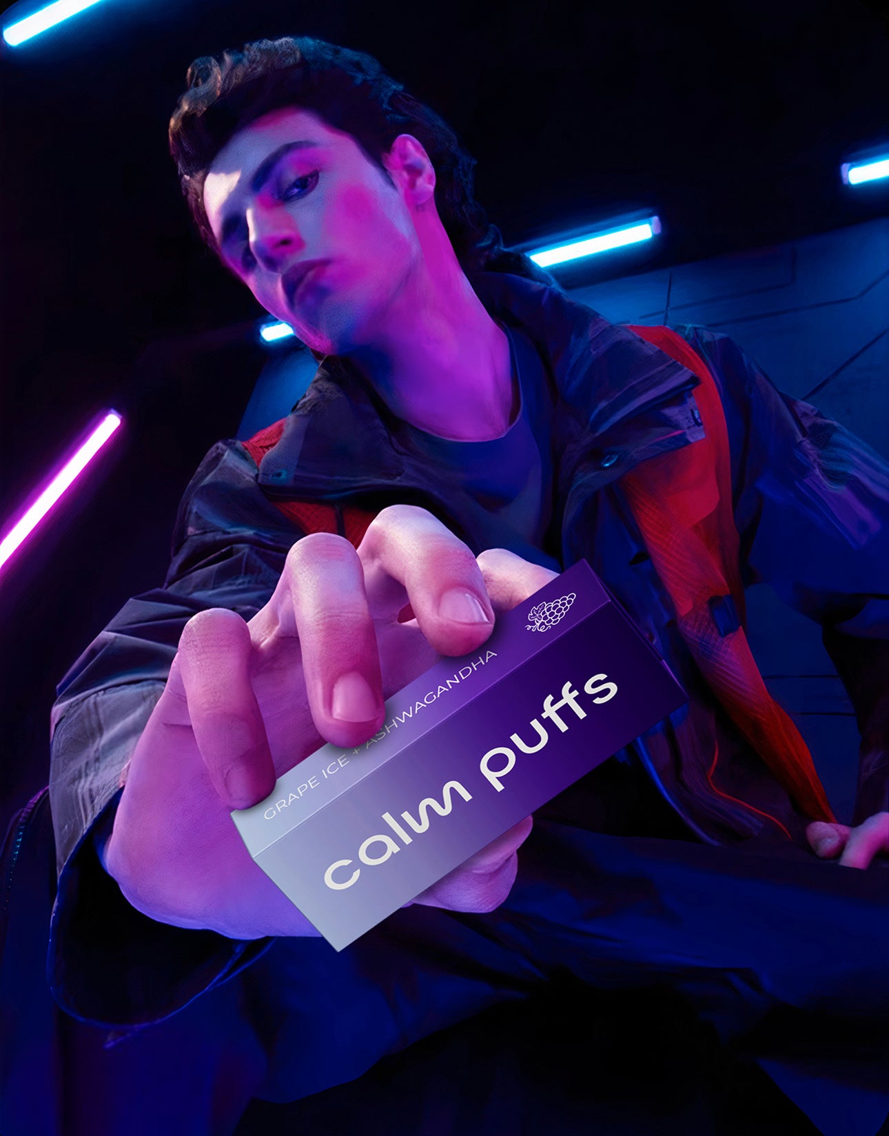 Person holding a box of 'calm puffs' with a dark, neon-lit background