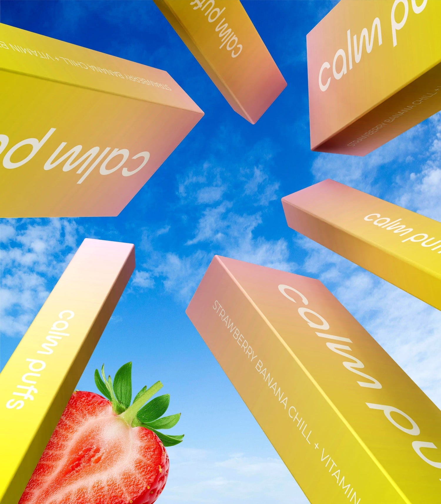 Calm Puffs Strawberry Banana Chill Vitamin B12 diffusers arranged against a bright blue sky with a fresh strawberry in the foreground.