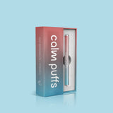 Calm Puffs Iced Watermelon Vitamin C diffuser in premium box on a light blue background.