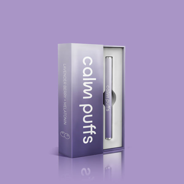 Calm Puffs Lavender Berry diffuser standing on purple background