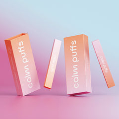 Two Cotton Candy diffusers standing in a blue and pink background