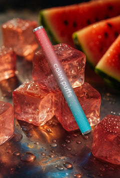 Calm Puffs Iced Watermelon + Vitamin C aromatherapy diffuser stick resting on ice cubes with fresh watermelon slices