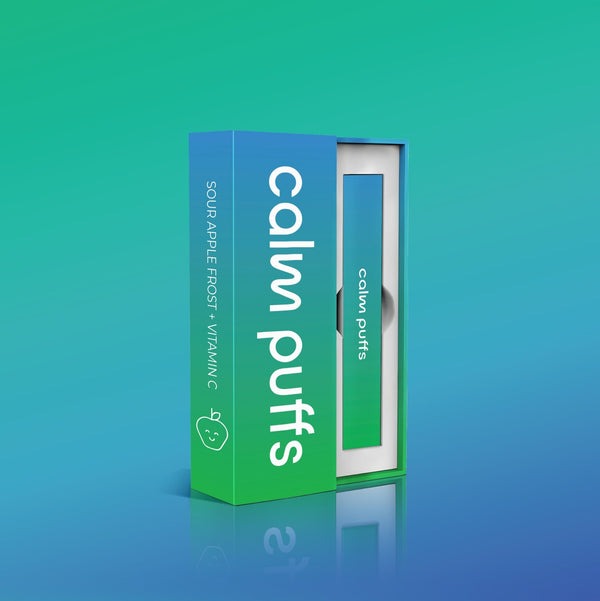 Calm Puffs Sour Apple Frost diffuser with Vitamin C in green and blue packaging on a gradient background